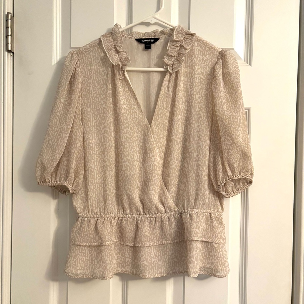 Express tan and cream dressy top with front enclosure and ruffles